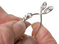Hands bending wrapped wire